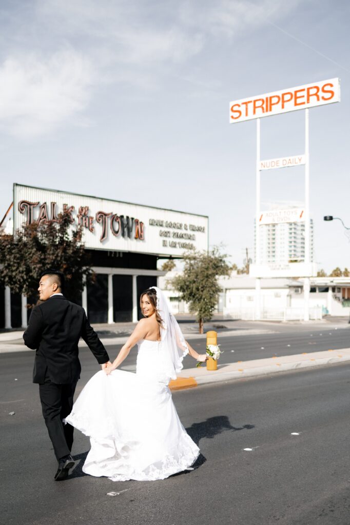 Bride and groom portraits on Fremont Street in Las Vegas