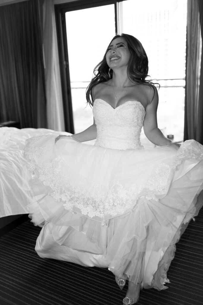 Bride excited and smiling in her dress