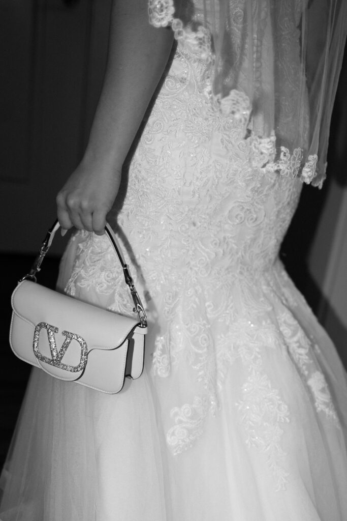 Bride carrying her designer purse