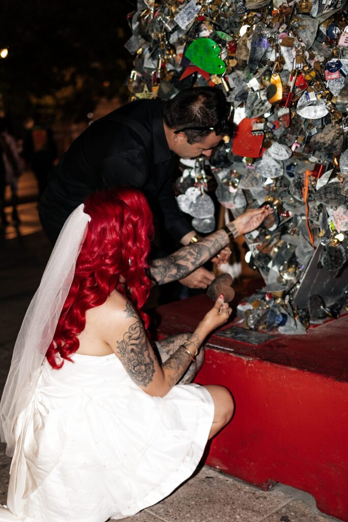 Bride and groom locking their love on Fremont Street Heart