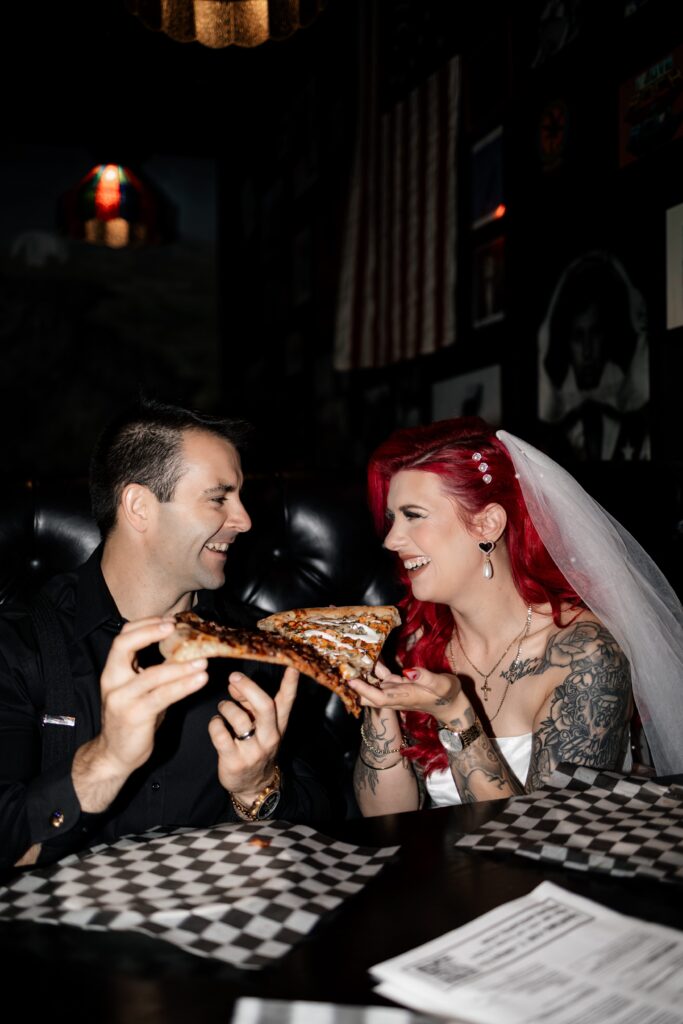 Bride and groom eating at Evel Pizza in Las Vegas