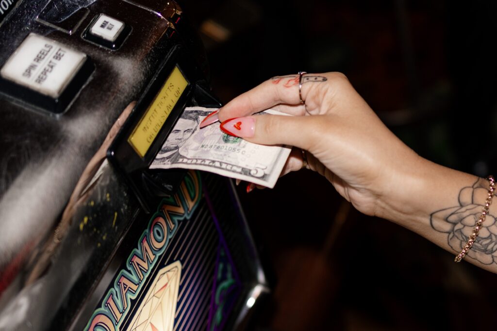 Bride putting money into casino slot