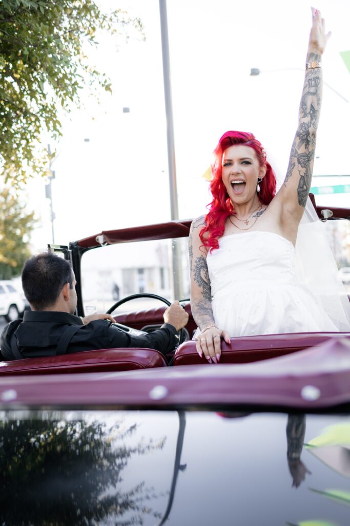 Bride and grooms portraits in a vintage car on Fremont Street after Sure Thing Chapel elopement