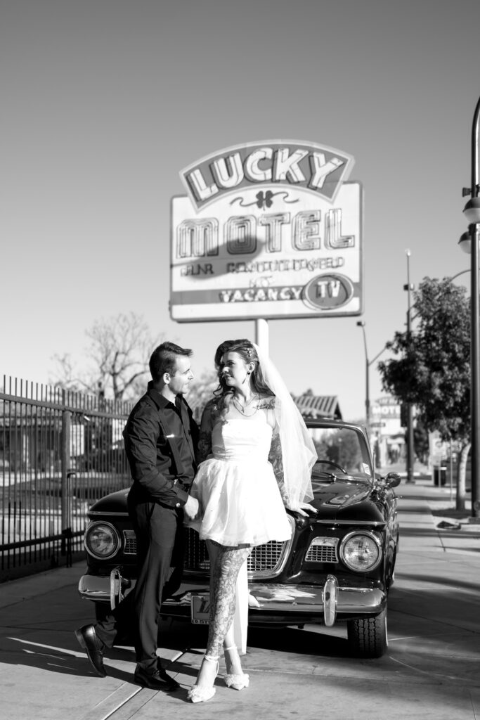 Bride and grooms portraits in a vintage car on Fremont Street after Sure Thing Chapel elopement