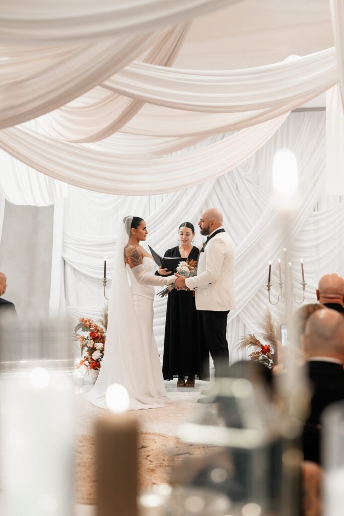 Couple holding hands during their That Chapel Downtown wedding in Las Vegas. 