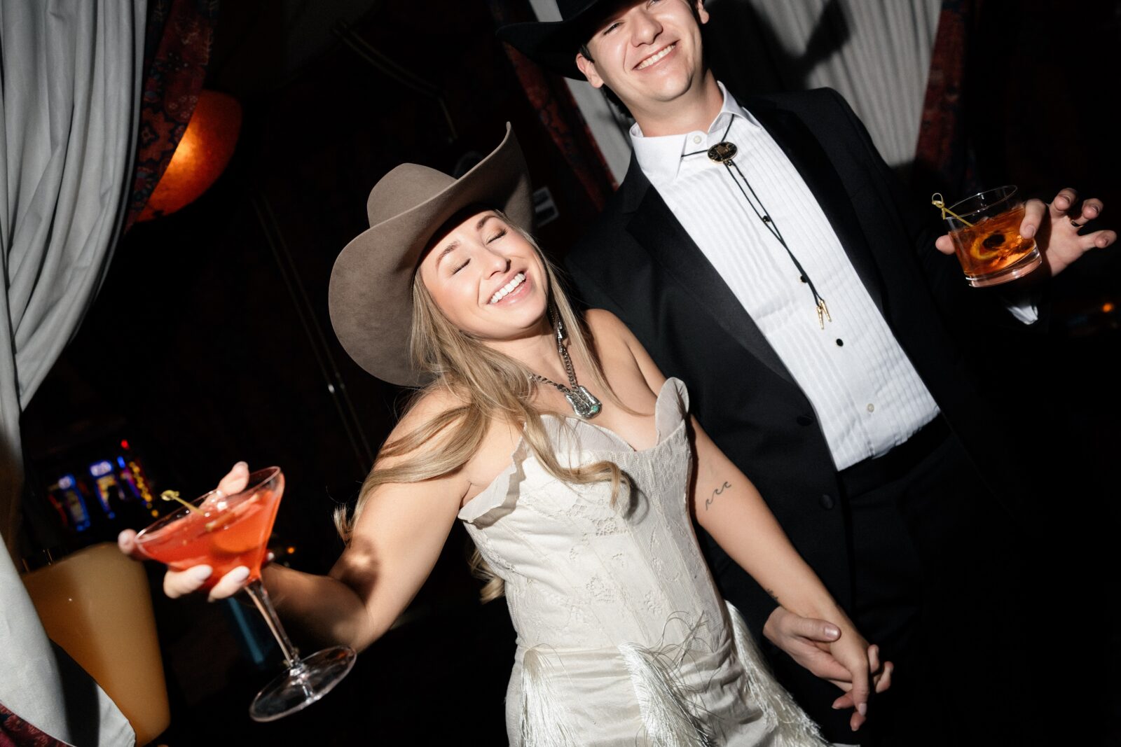 Couple toasting with drinks during their Las Vegas elopement. 