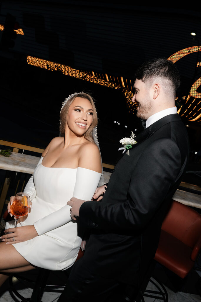 Bride and groom having drinks at Carousel Bar in Las Vegas.