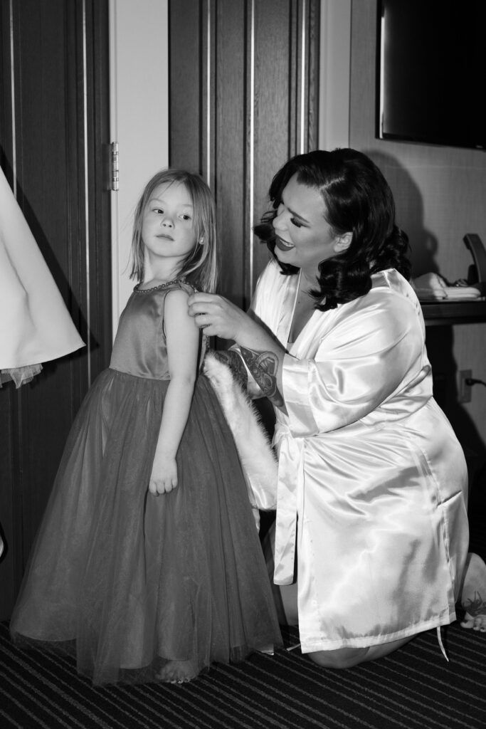 Bride getting ready with her daughter before her wedding