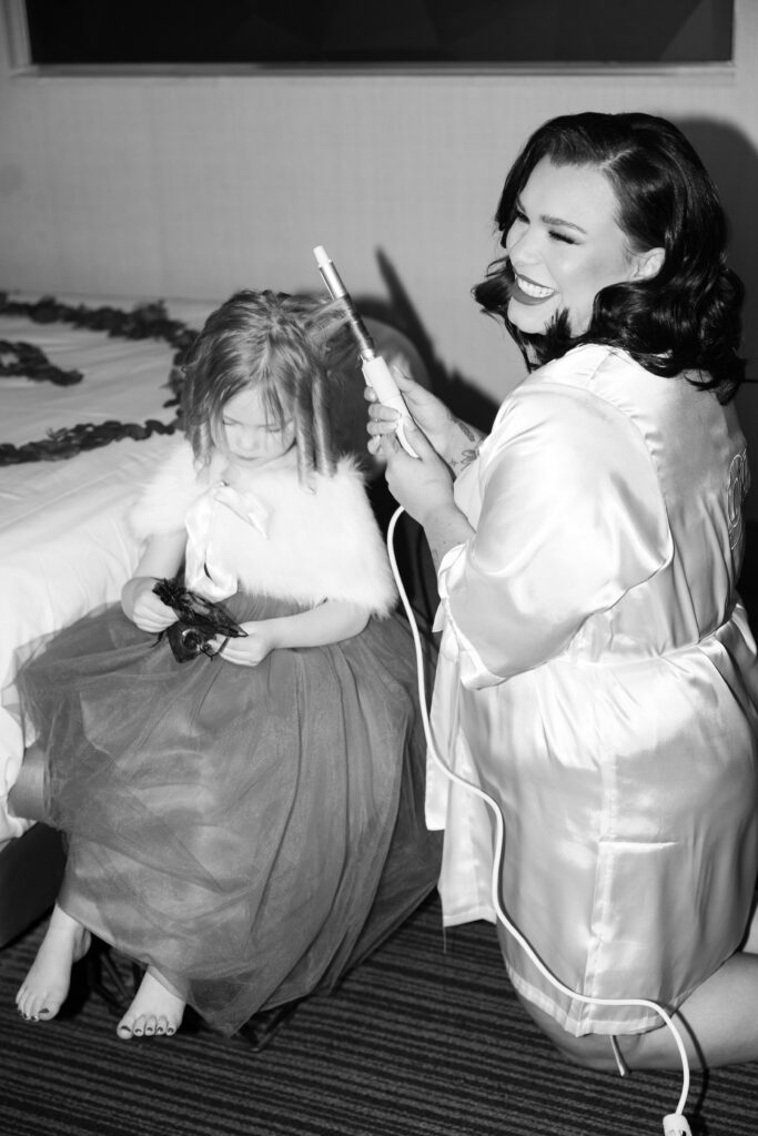 Bride getting ready with her daughter before her wedding