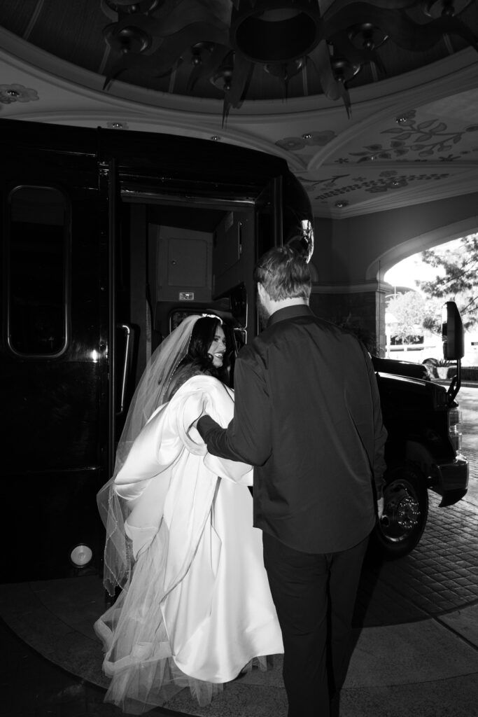 Bride and groom getting on the party bus