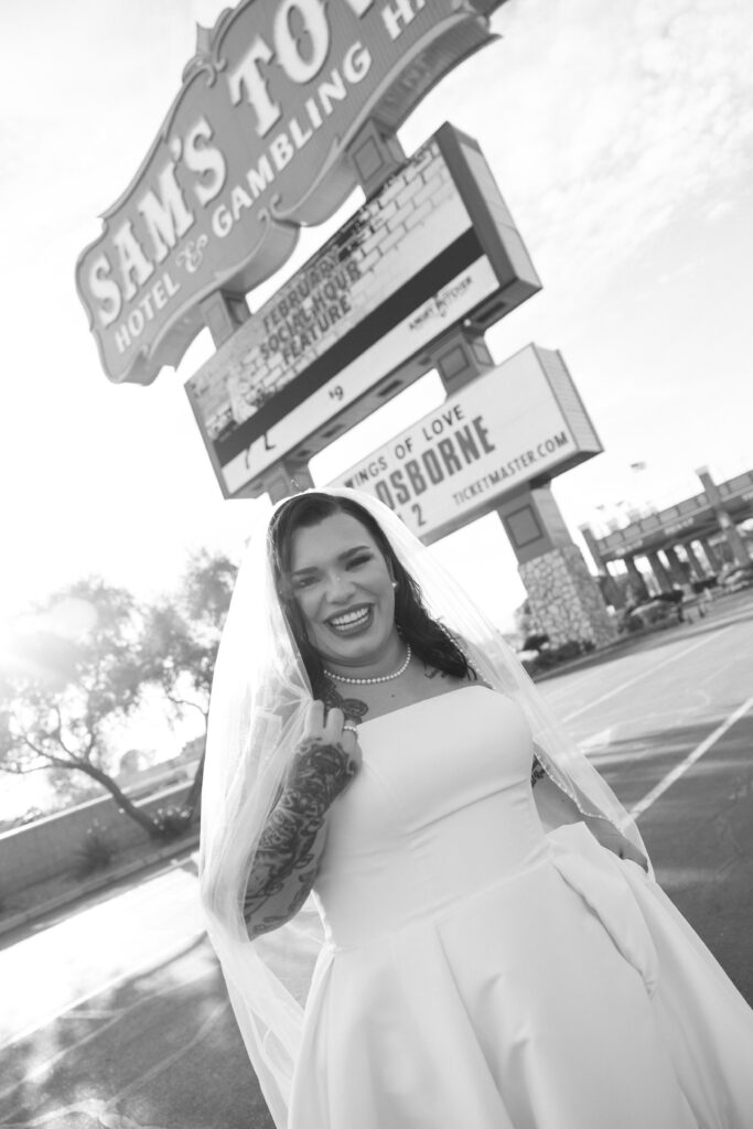 Bride posing for photos in front of Sam Town Hotel and Gambling Hall 