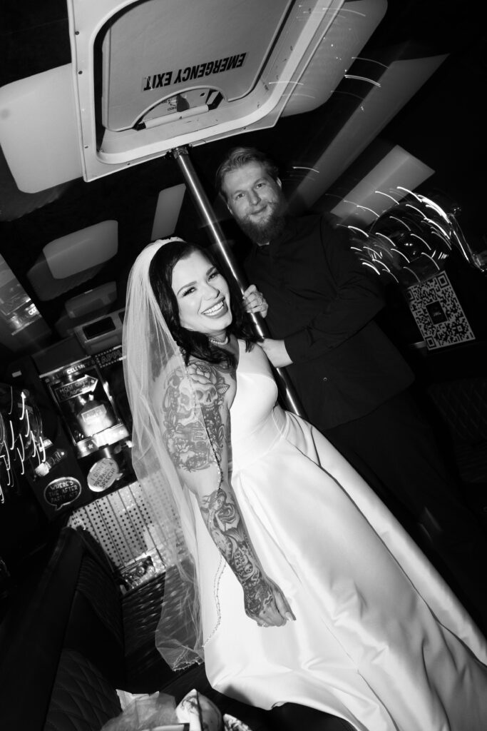 Bride and groom on their party bus