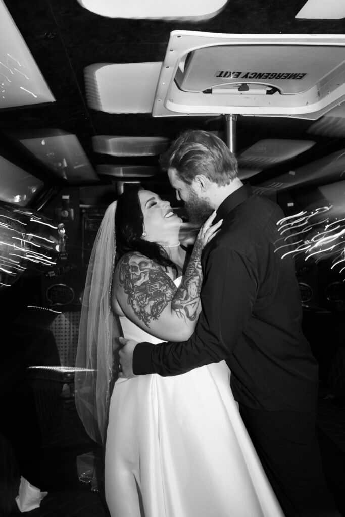 Bride and groom on their party bus