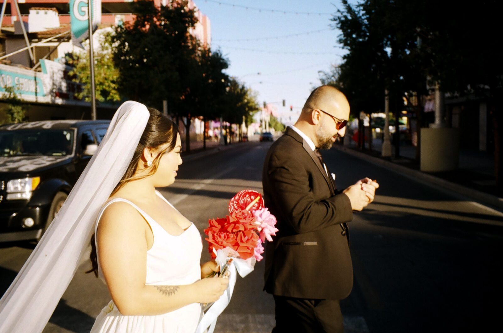 Bride and groom walking downtown Las Vegas