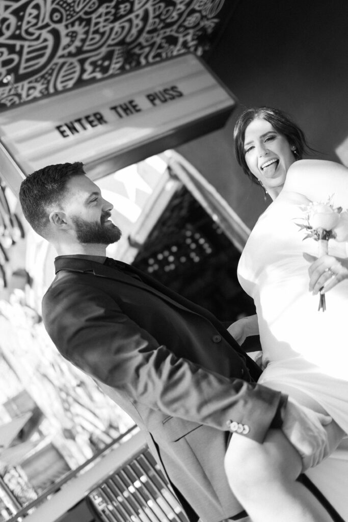 Bride and grooms portraits down Fremont Street in Vegas