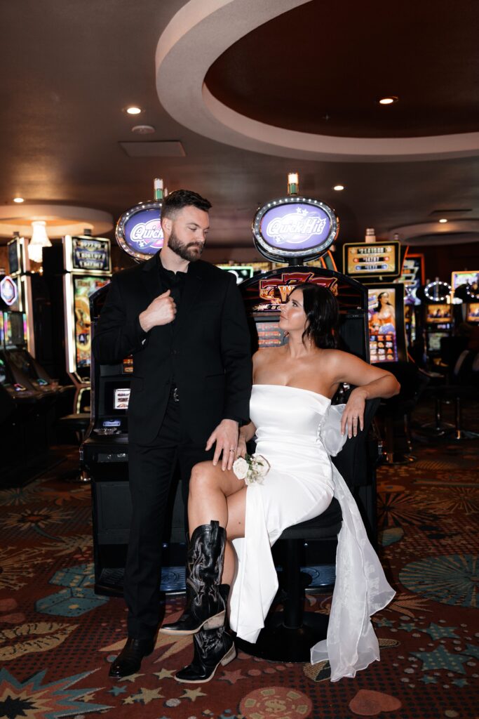 Bride and groom posing for photos at the casino