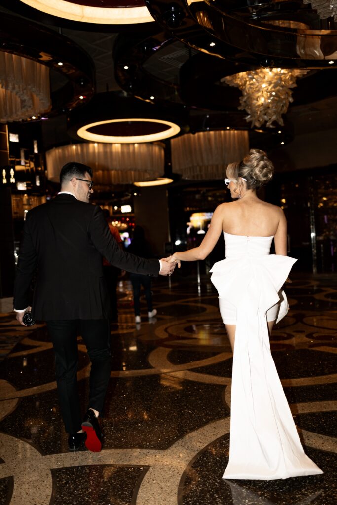 Bride and groom walking in the lobby of The Cosmopolitan Hotel in Las Vegas