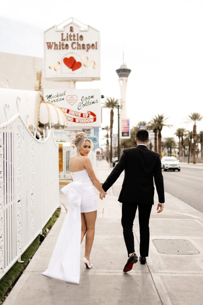 Bride and groom portraits in front of The Little White Chapel during their elopement in Vegas