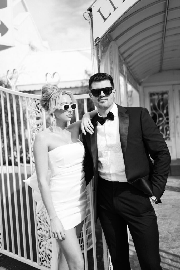 Black and white editorial styled photo of a bride and groom at The Little White Chapel during their elopement in Vegas
