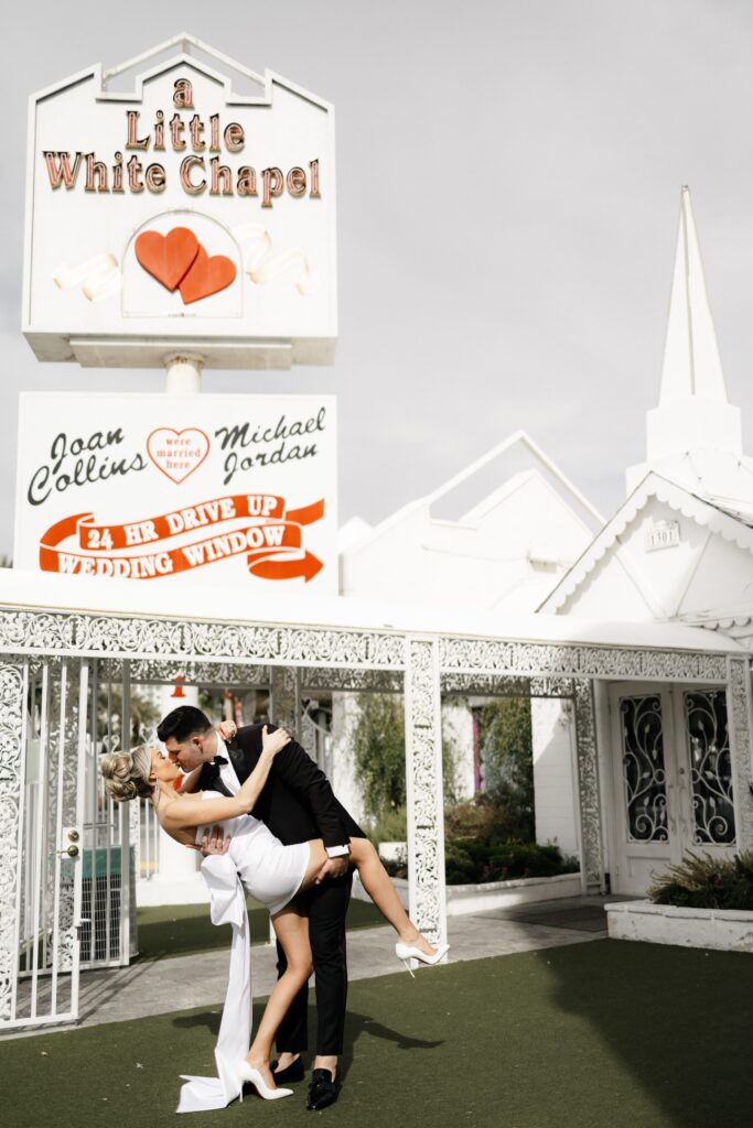 Bride and groom kissing at The Little White Chapel during their elopement in Vegas