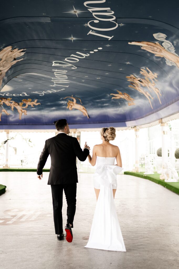 Bride and groom walking in the the Tunnel of Love during their elopement in Vegas