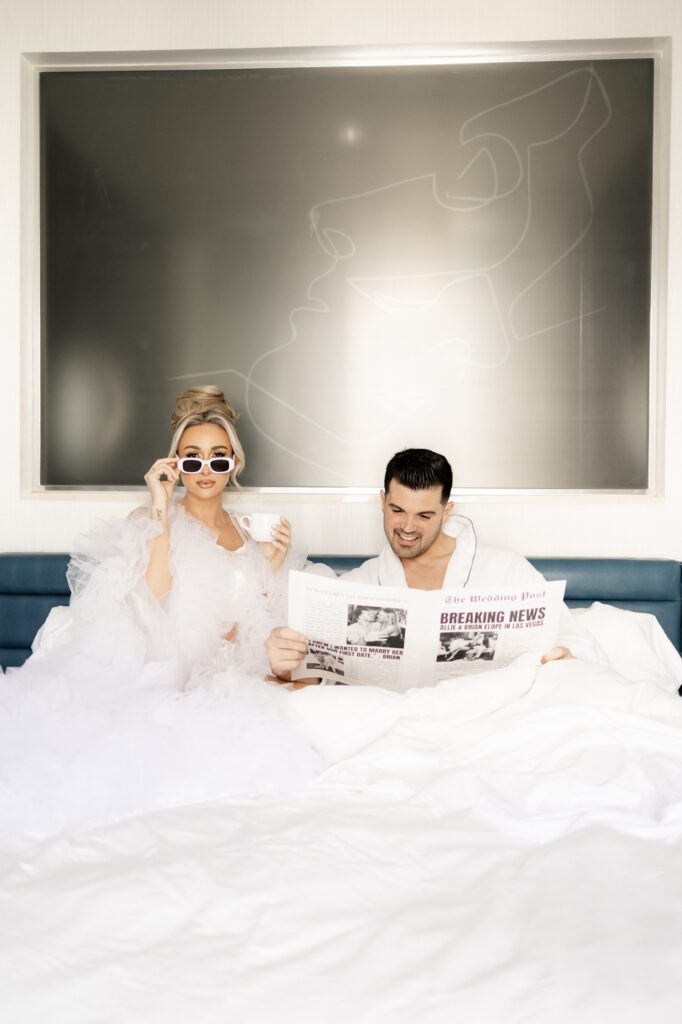 Bride drinking coffee as grooms reads their custom elopement announcement newspaper