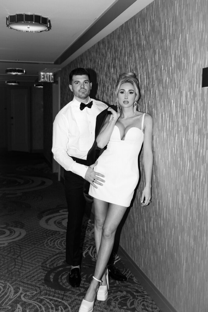 Black and white flash photo of a bride and groom in the hallways of The Cosmopolitan Hotel in Las Vegas