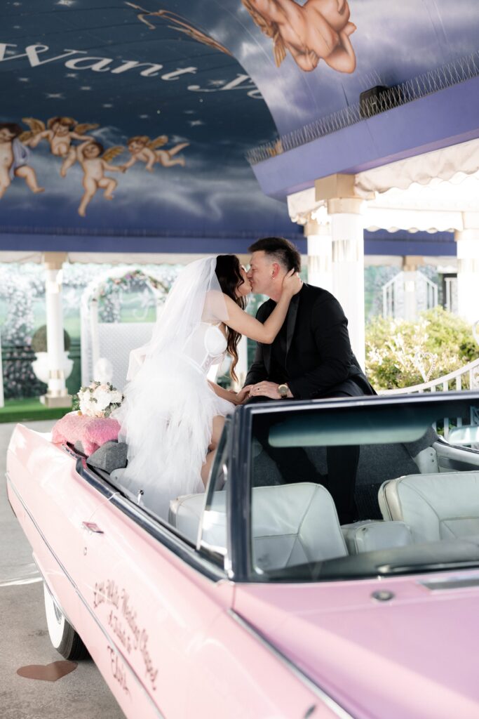 Bride and groom getting eloped in Las Vegas at The Little White Chapel during their Pink Cadillac Ceremony