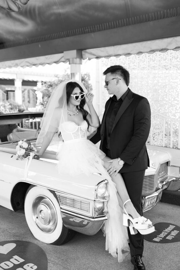Black and white photo of a bride ands groom getting eloped in Las Vegas at The Little White Chapel