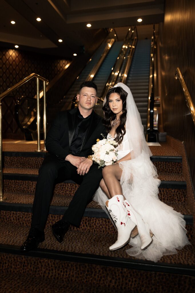 Bride and groom sitting on the stairs at Luxor Hotel in Las Vegas