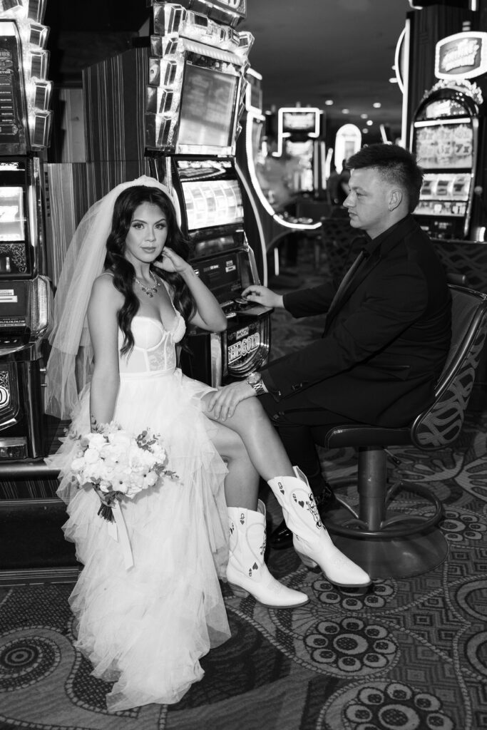 Black and white photo of bride and groom at the casino