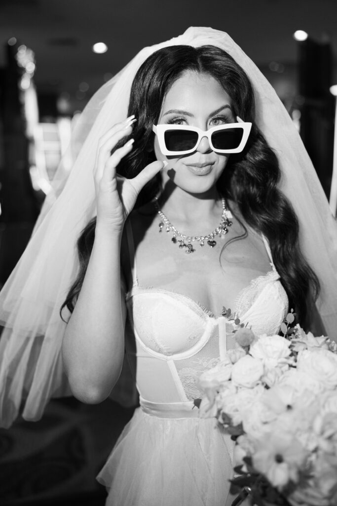 Black and white photo of a bride in a casino