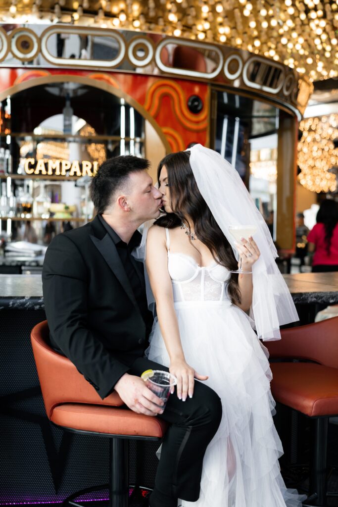 Bride and groom getting drinks at The Carousel Bar at Plaza in Las Vegas