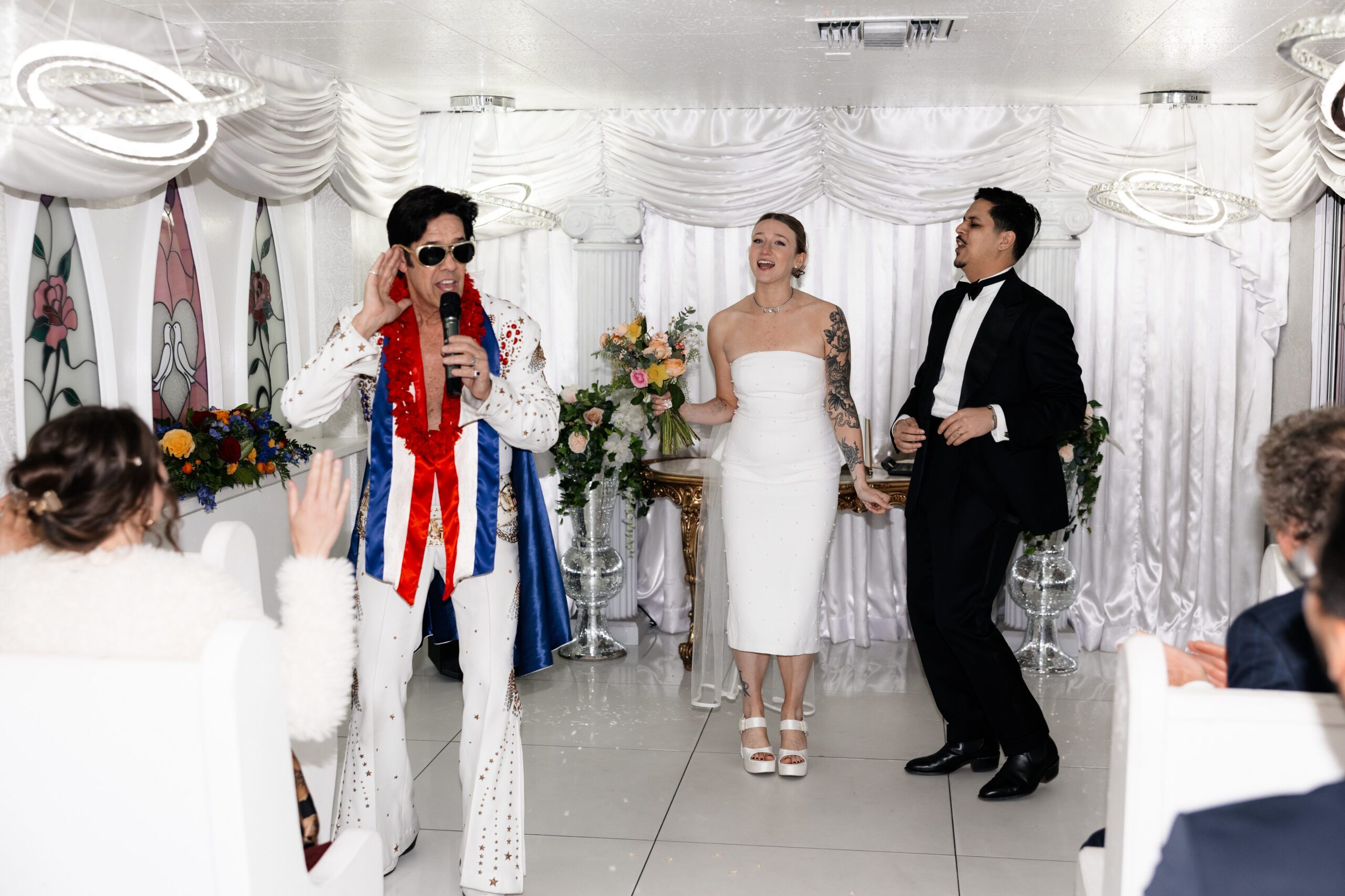 Bride and groom during Elvis' performances at The Little White Chapel