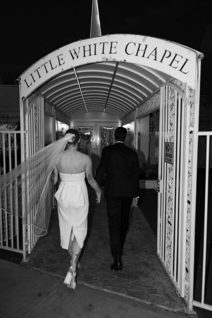 Black and white bride and groom portraits outside of The Little White Chapel