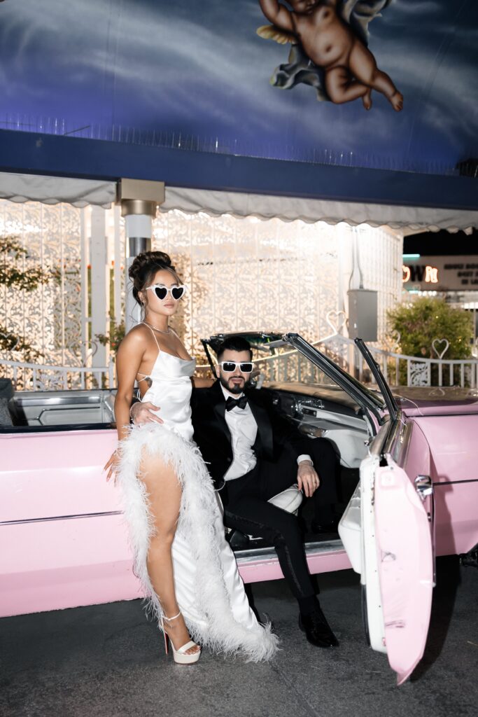 Bride and groom flash portraits with the Pink Cadillac in The Tunnel of Love in Las Vegas