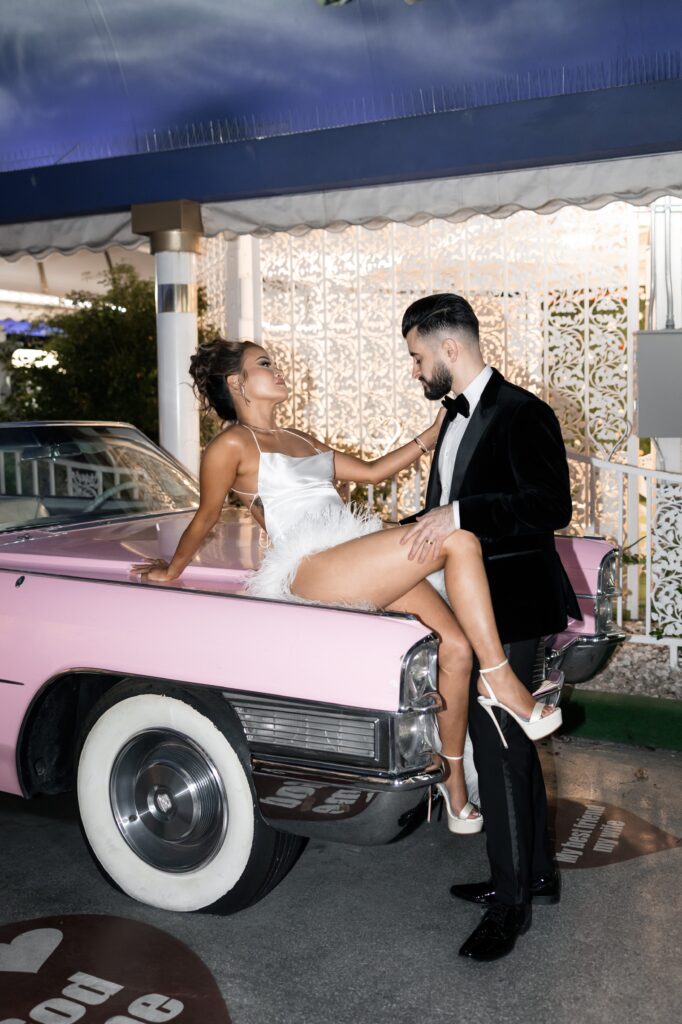 Bride and groom flash portraits with the Pink Cadillac in The Tunnel of Love in Las Vegas