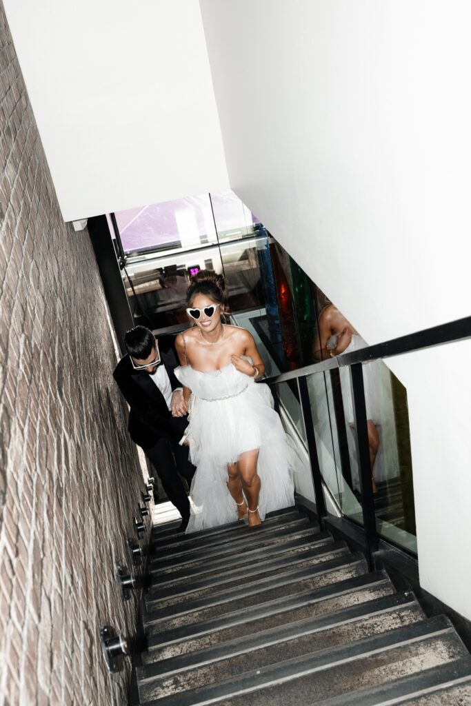Bride and groom walking up the stairs for their Las Vegas Taco Bell wedding
