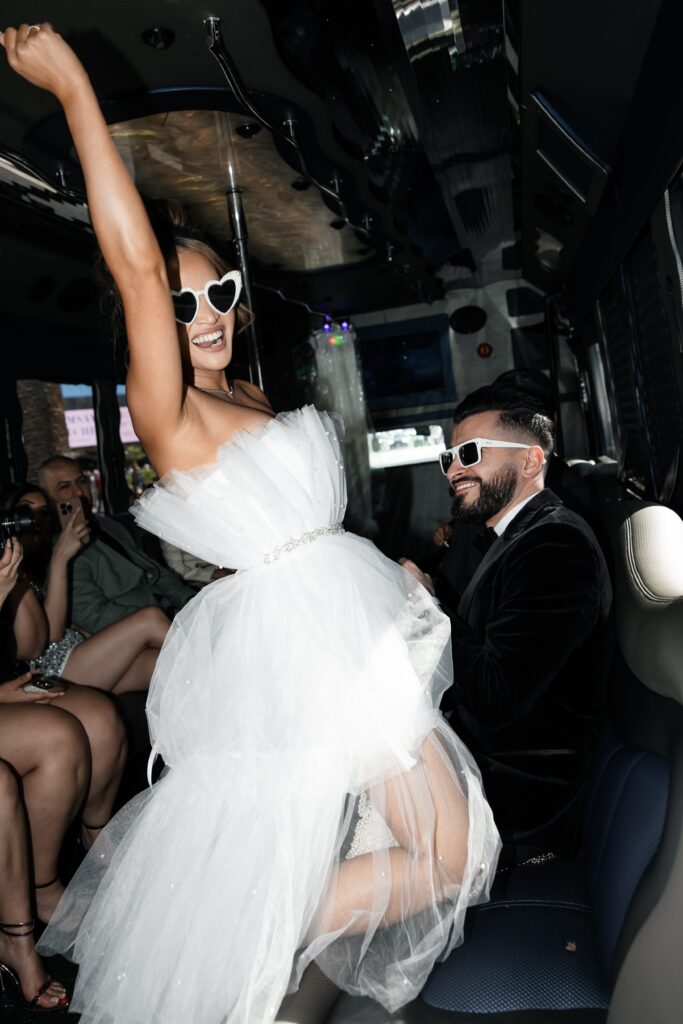 Bride and groom on the party bus on their way to their Las Vegas Taco Bell wedding