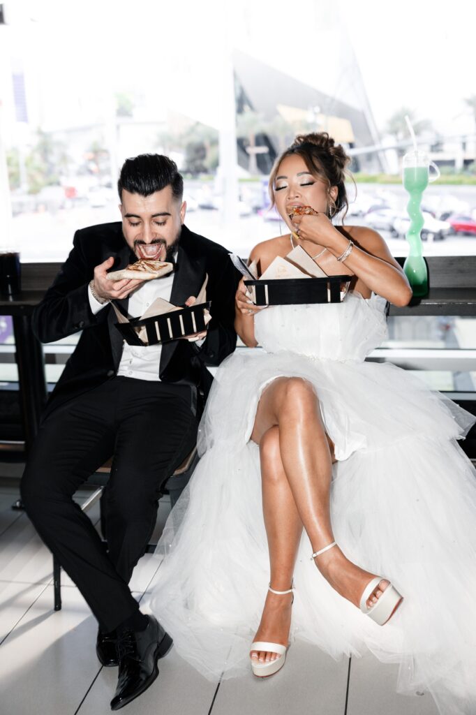 Bride and groom eating Mexican pizza after their Taco Bell Las Vegas wedding
