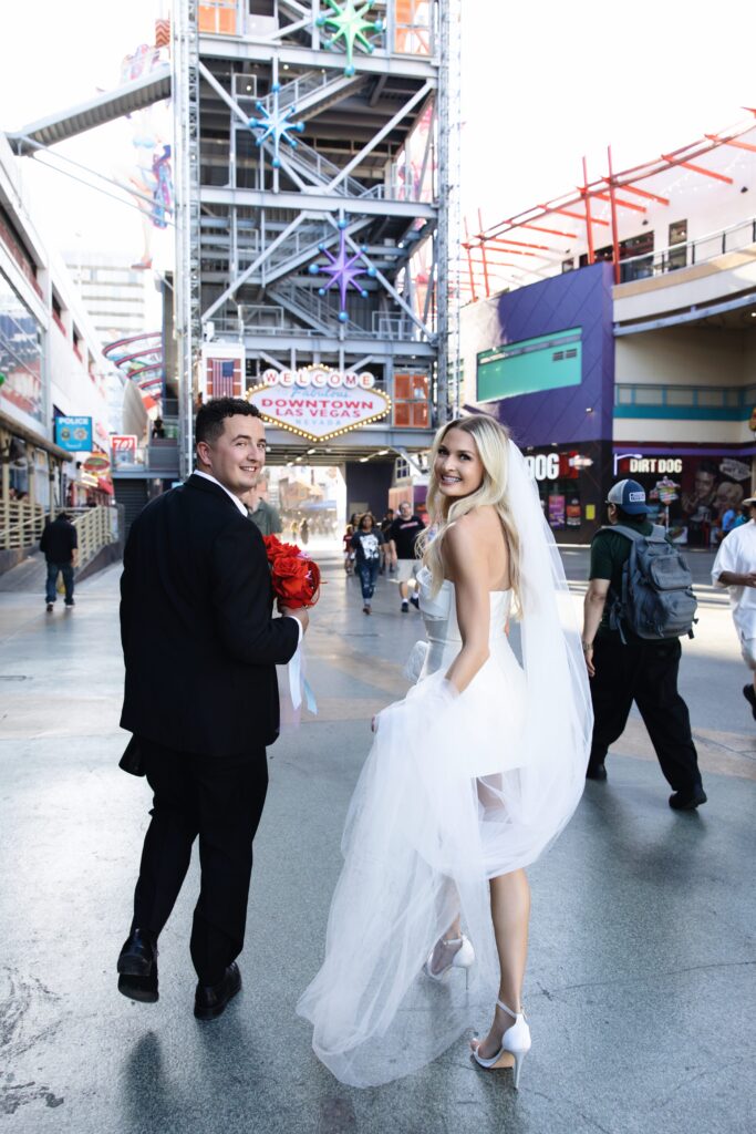 Bride and groom walking in downtown Las Vegas
