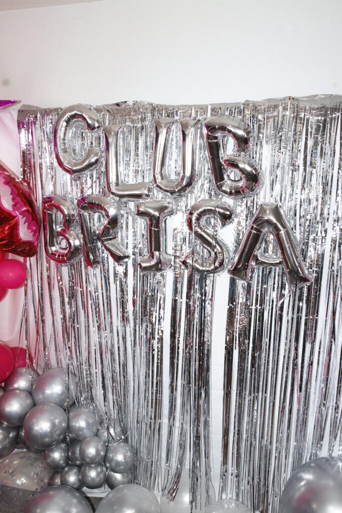 Brides bachelorette set up with balloons that say "Club Brisa"