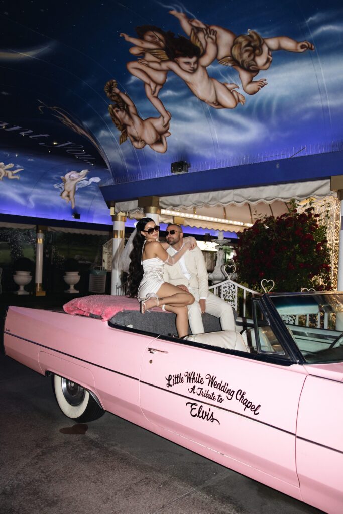 Editorial elopement photos with the Pink Cadillac at Little White Wedding Chapel in Las Vegas