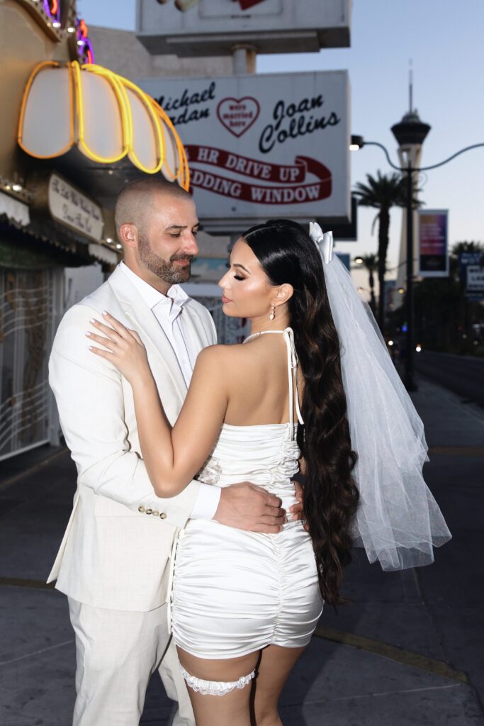 Flash elopement portraits of a bride and groom at Little White Wedding Chapel in Las Vegas