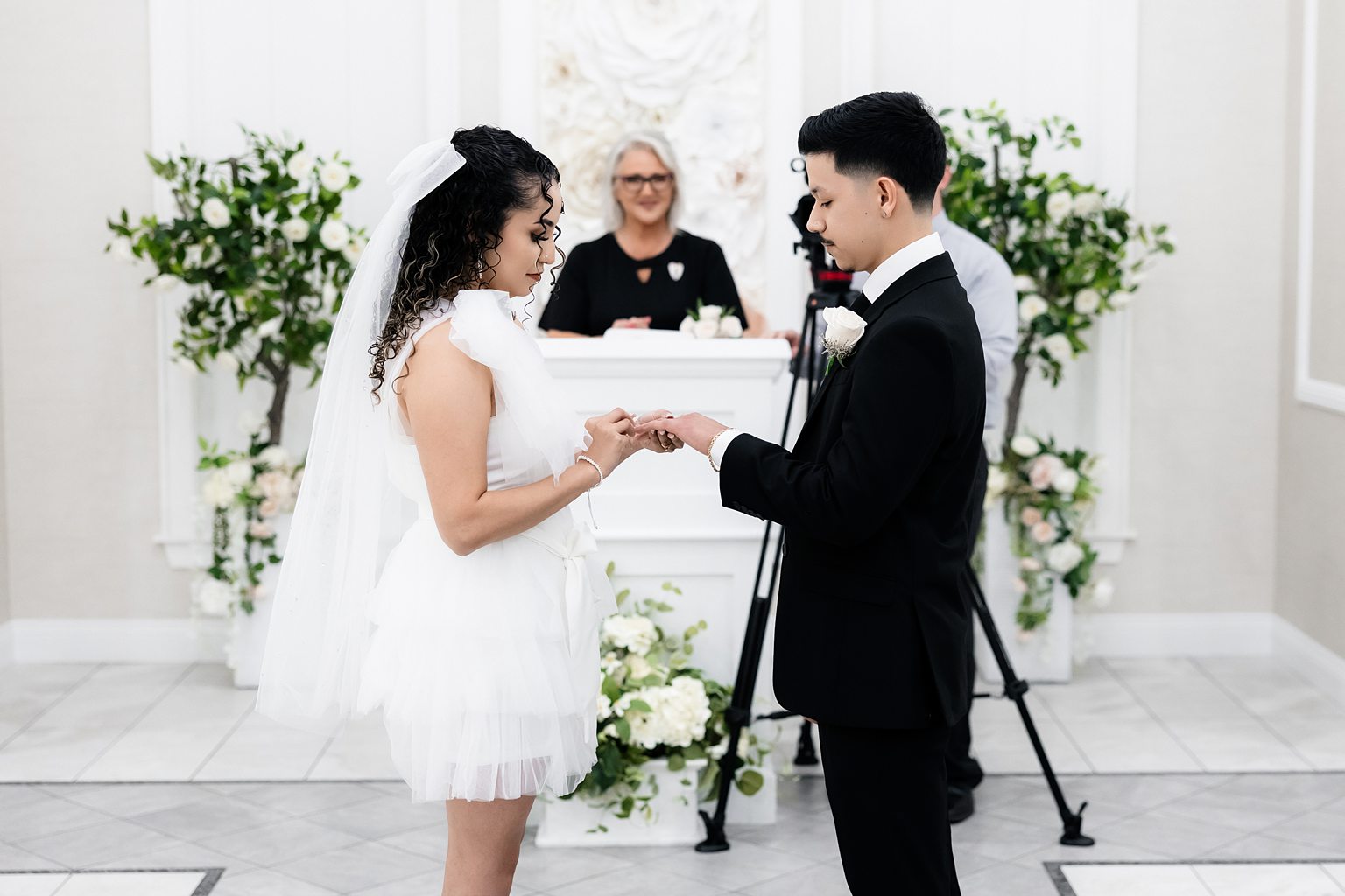 Bride and groom exchanging rings during their Bliss Chapel ceremony in Las Vegas