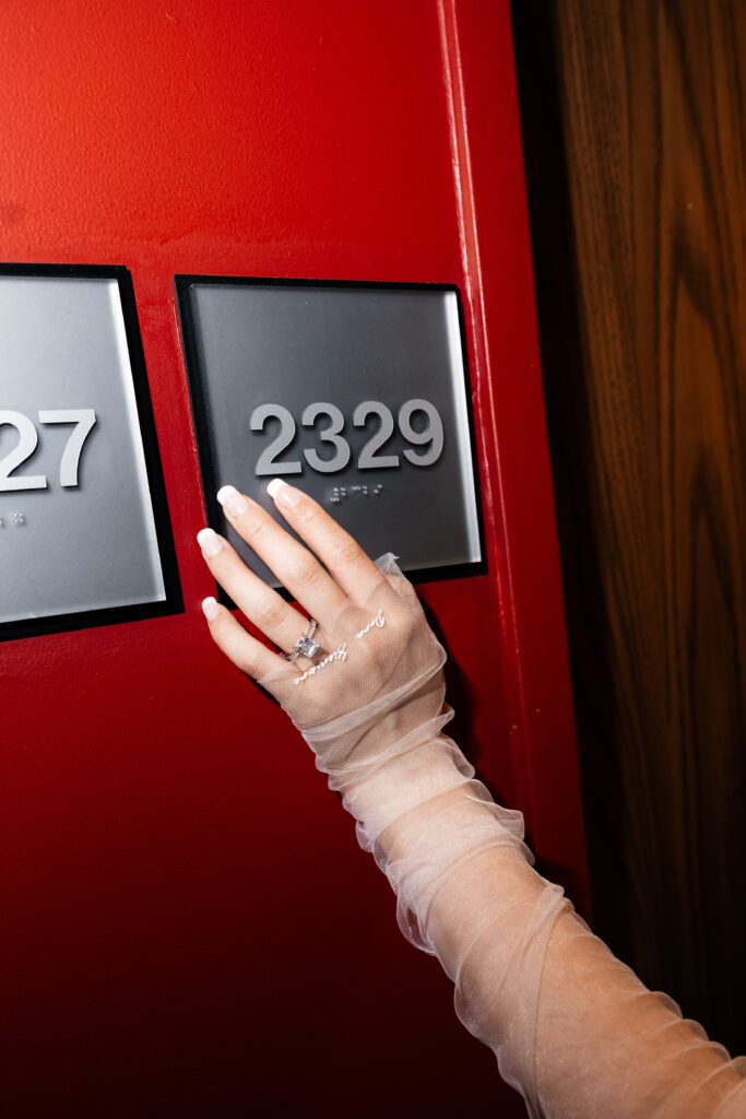 Brides hand on her hotel room number at the D Hotel & Casino