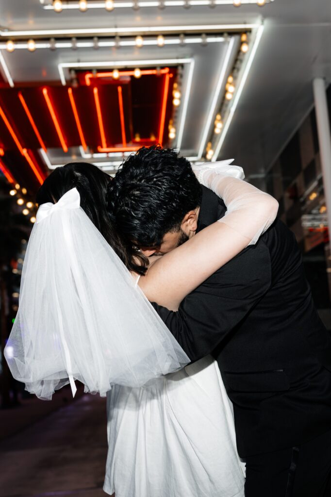 Bride and groom hugging during their downtown fun elopement in Vegas