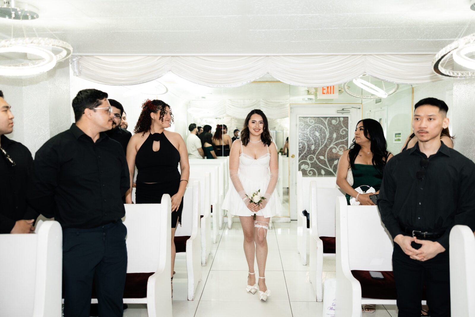 Bride walking down the aisle for her Little White Wedding Chapel ceremony