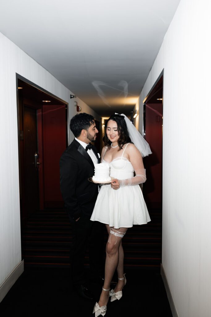 Bride and groom with their Las Vegas elopement cake