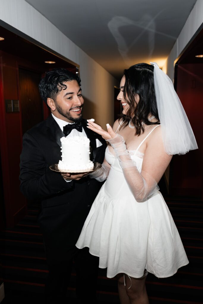 Bride and groom with their Las Vegas elopement cake